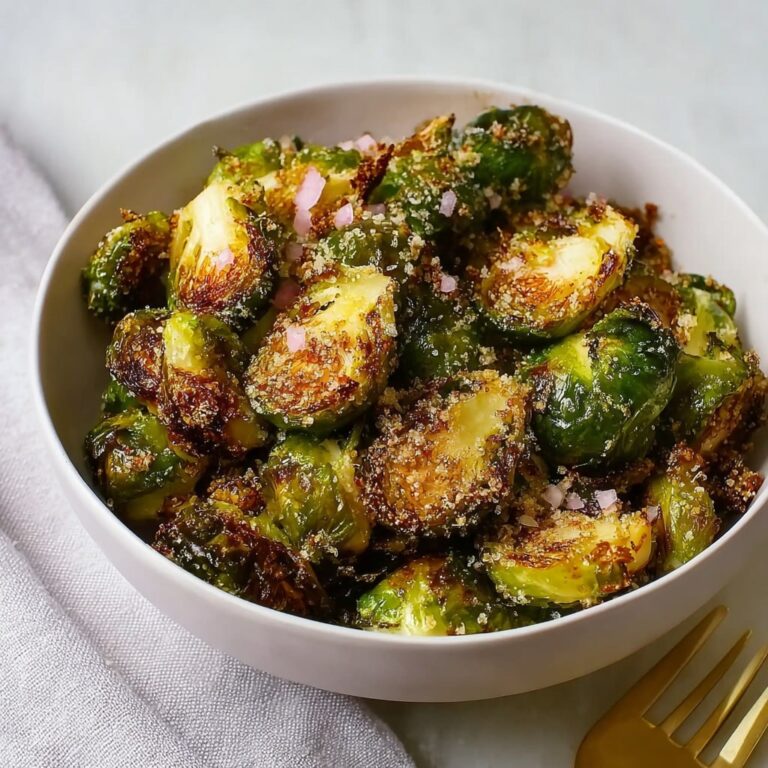 Crispy air fryer Brussels sprouts in a bowl with balsamic glaze